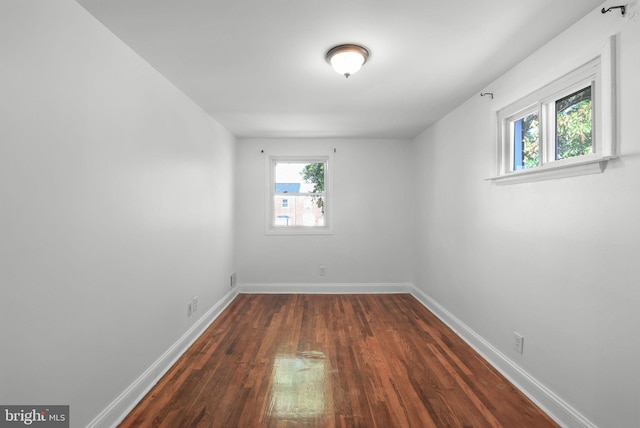 empty room featuring dark hardwood / wood-style floors