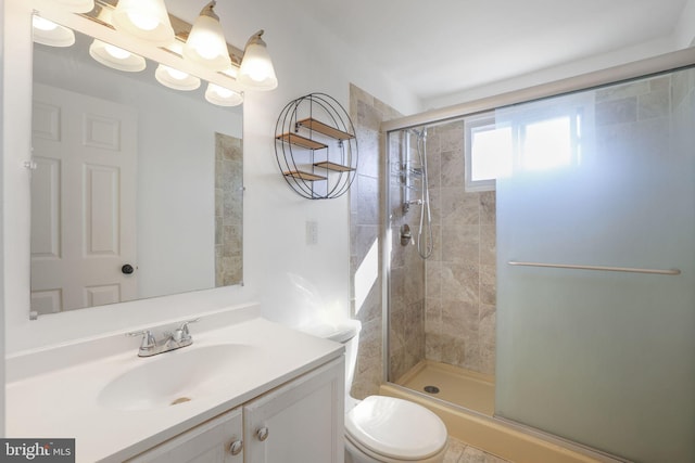 bathroom with toilet, walk in shower, vanity, and tile patterned flooring