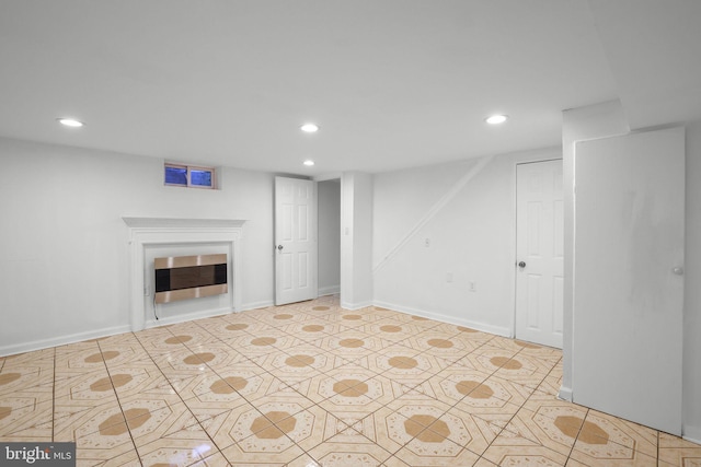 basement featuring light tile patterned floors