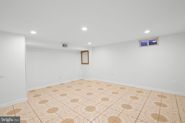 basement featuring light tile patterned flooring