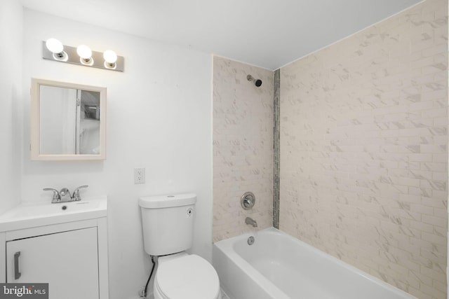 full bathroom featuring vanity, toilet, and tiled shower / bath