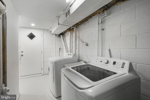 laundry area with washing machine and dryer