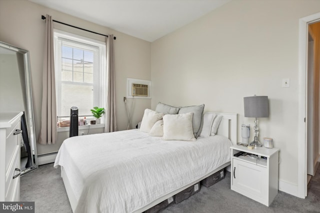 bedroom with a baseboard radiator, light colored carpet, and a wall mounted air conditioner