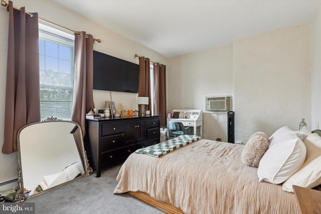 bedroom featuring light carpet and a wall mounted AC