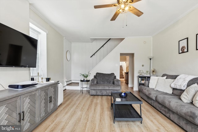 living room with ceiling fan, ornamental molding, and light hardwood / wood-style floors