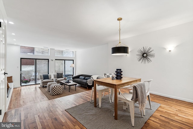 dining area with light wood-type flooring