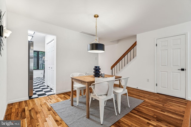 dining space featuring hardwood / wood-style flooring