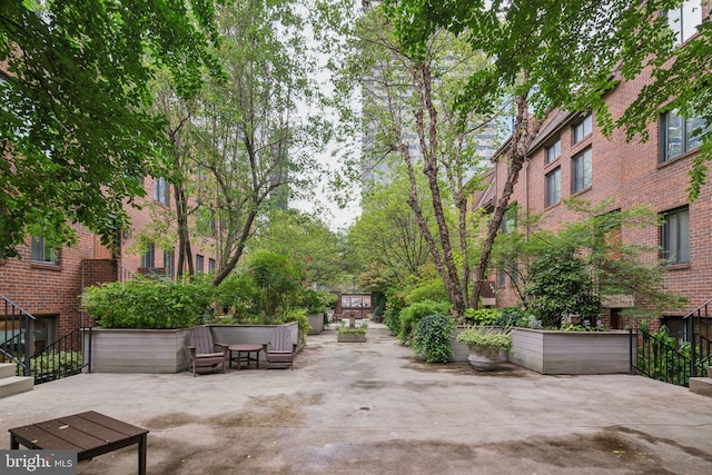 view of property's community with a patio area