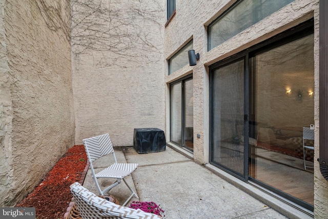 view of patio featuring a grill