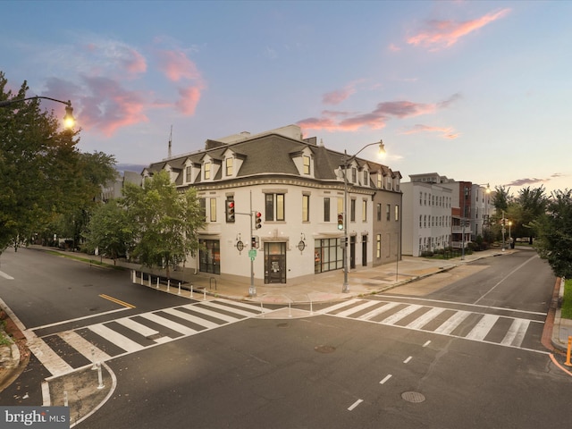 view of outdoor building at dusk