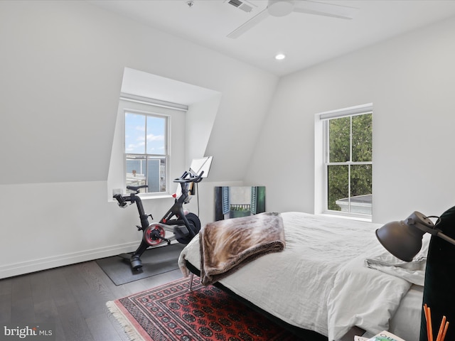 bedroom with ceiling fan, hardwood / wood-style floors, and multiple windows