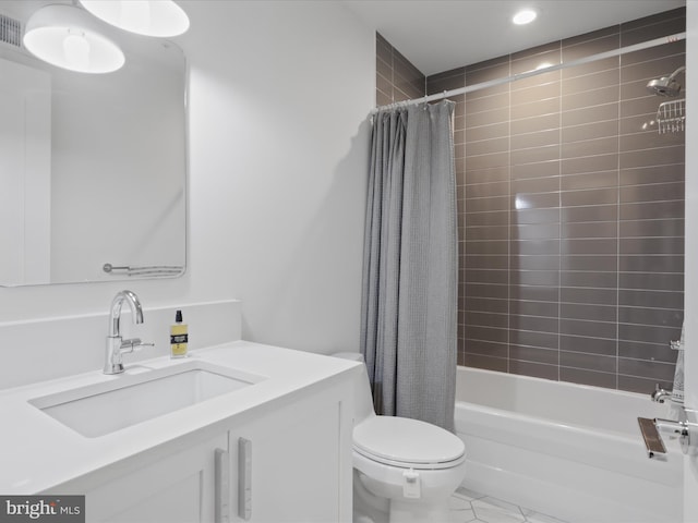 full bathroom featuring tile patterned floors, shower / bath combo, vanity, and toilet