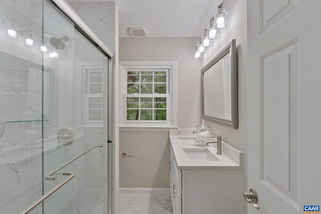 bathroom featuring vanity and an enclosed shower