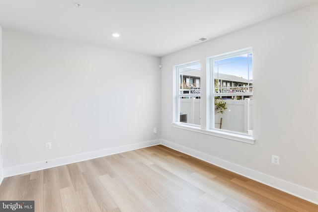 spare room featuring light hardwood / wood-style flooring