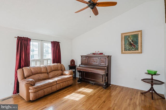 sitting room with ceiling fan, lofted ceiling, and light hardwood / wood-style floors