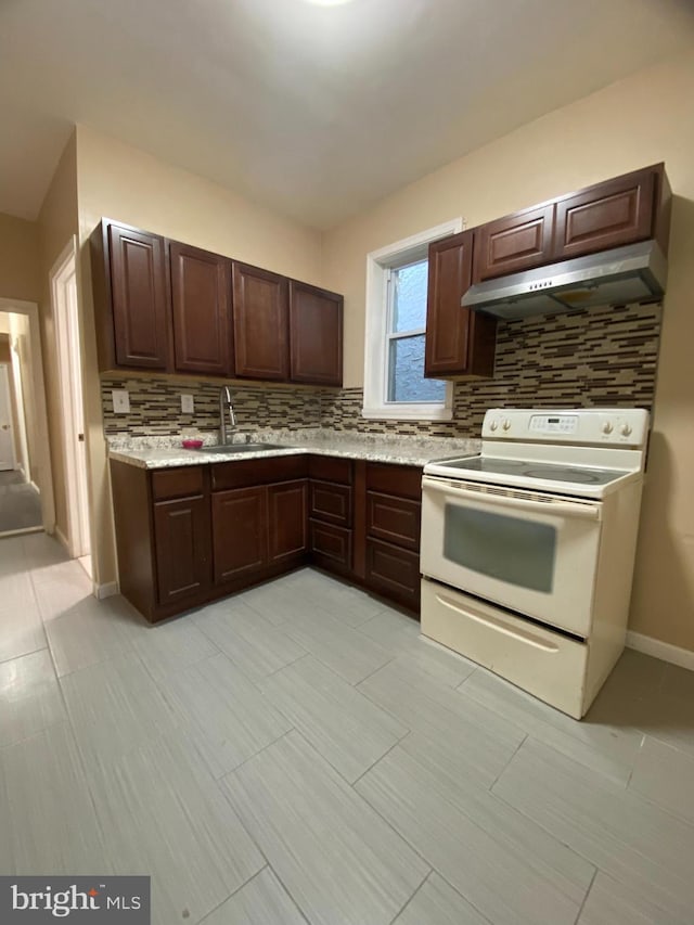 kitchen with tasteful backsplash, light tile patterned flooring, sink, white range with electric stovetop, and extractor fan