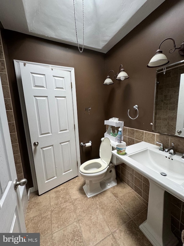 bathroom with tile patterned flooring and toilet