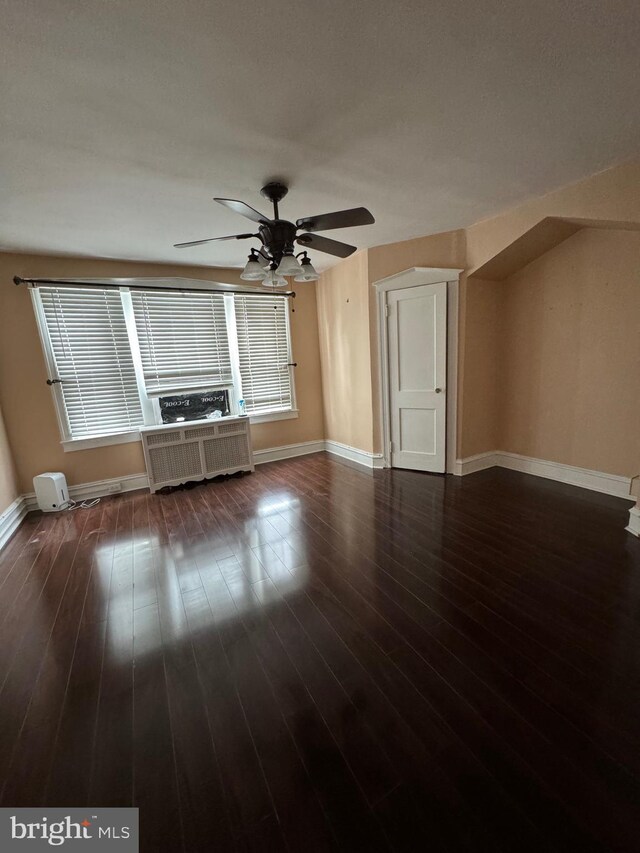 3413 Tudor St, Philadelphia, PA 19136 - unfurnished living room featuring radiator, baseboards, and wood finished floors