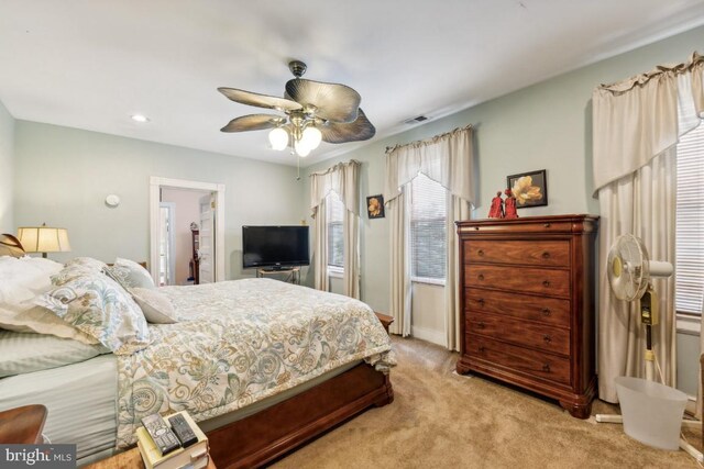 carpeted bedroom with ceiling fan