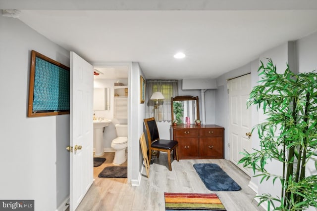 bathroom featuring hardwood / wood-style floors and toilet