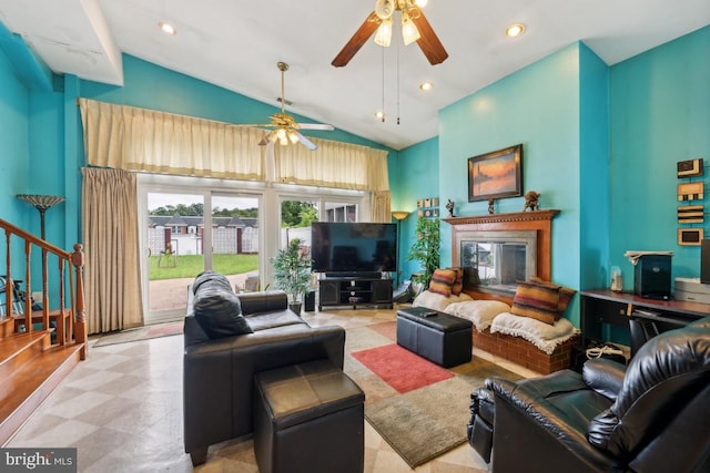 living room featuring ceiling fan and high vaulted ceiling