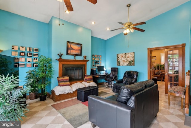 living room with high vaulted ceiling and ceiling fan