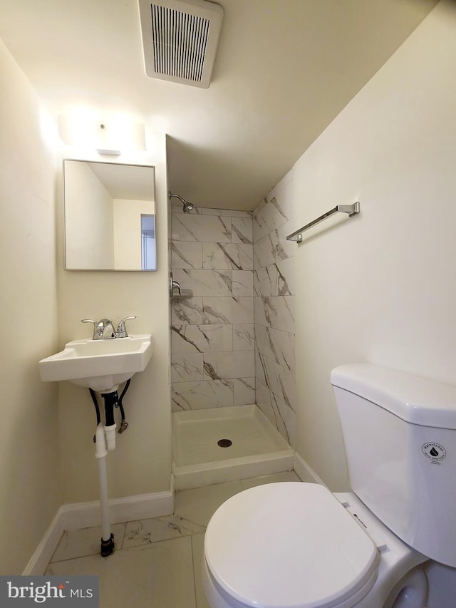 full bathroom with marble finish floor, toilet, a stall shower, and visible vents