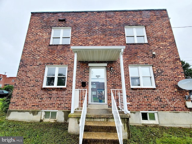 view of front of house featuring brick siding