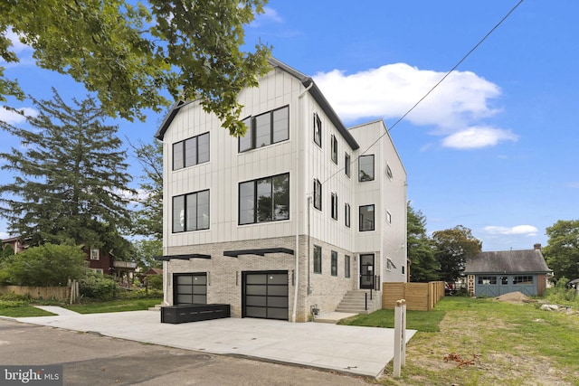 view of front of house with a front lawn and a garage