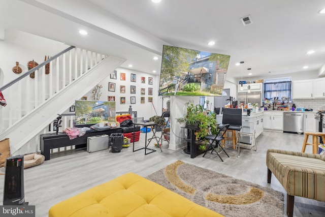 living room with light hardwood / wood-style floors