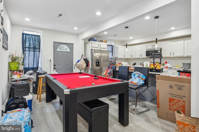 rec room with pool table and light hardwood / wood-style floors