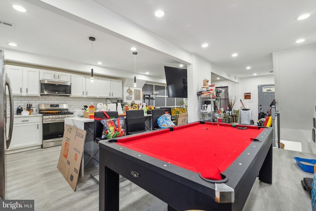 recreation room with light hardwood / wood-style floors and pool table