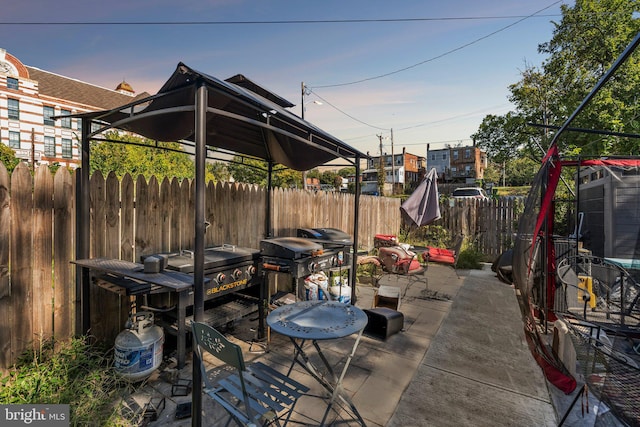 view of patio terrace at dusk