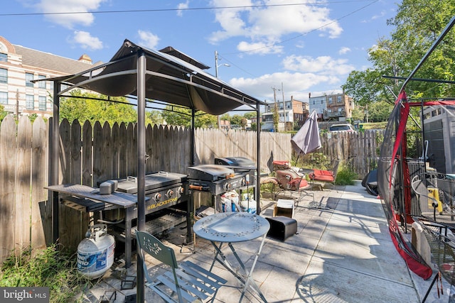 view of patio with a grill