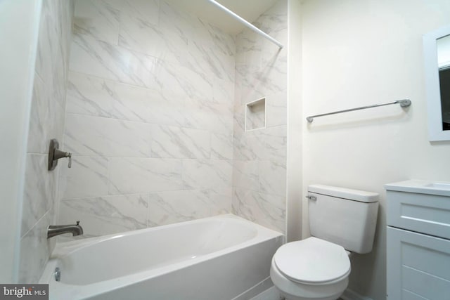 full bathroom with vanity, toilet, and tiled shower / bath