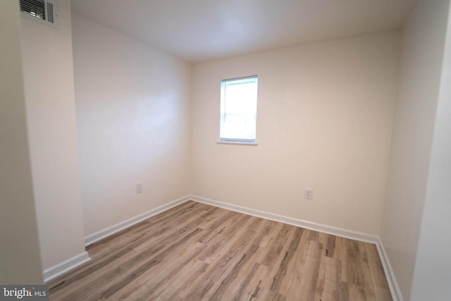 spare room with light hardwood / wood-style flooring