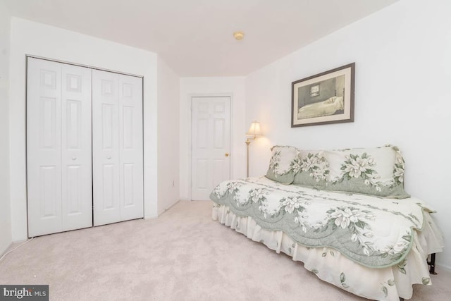 carpeted bedroom with a closet