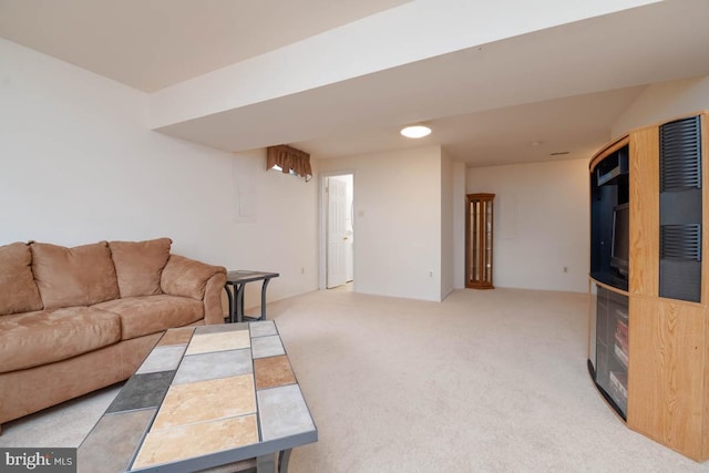 living room featuring light carpet