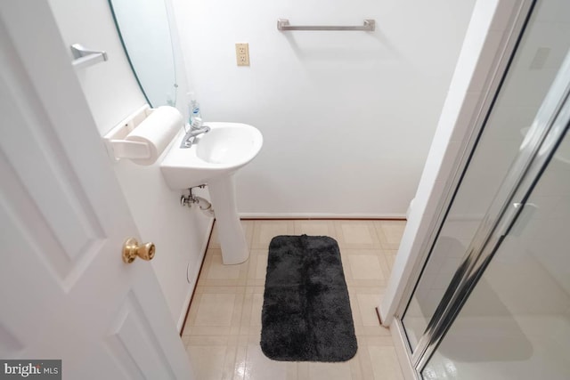 bathroom featuring tile patterned floors and walk in shower