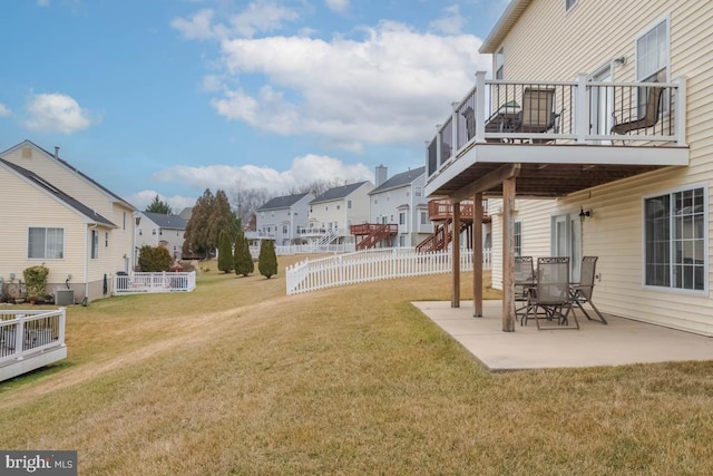 view of yard featuring central AC unit and a patio