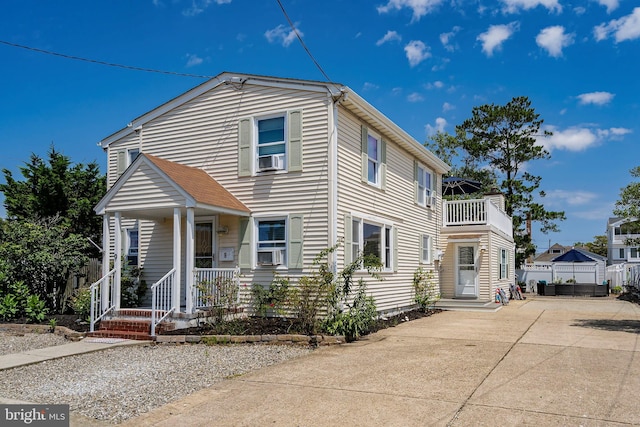 view of front of home featuring a balcony