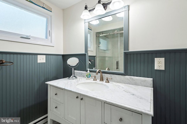 bathroom featuring vanity and a shower with shower door