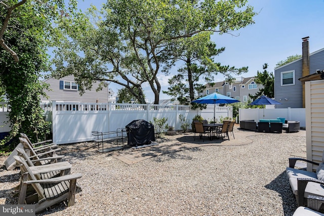 view of yard with outdoor lounge area and a patio area