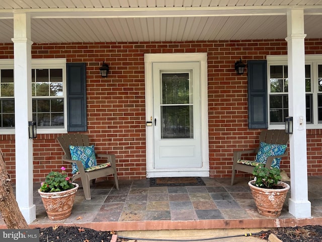 property entrance featuring covered porch