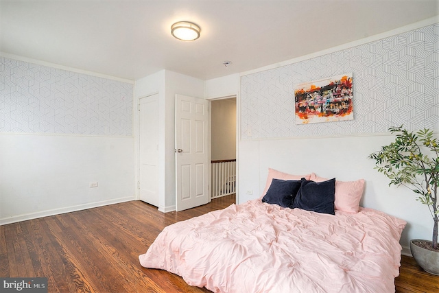 bedroom with dark wood-type flooring