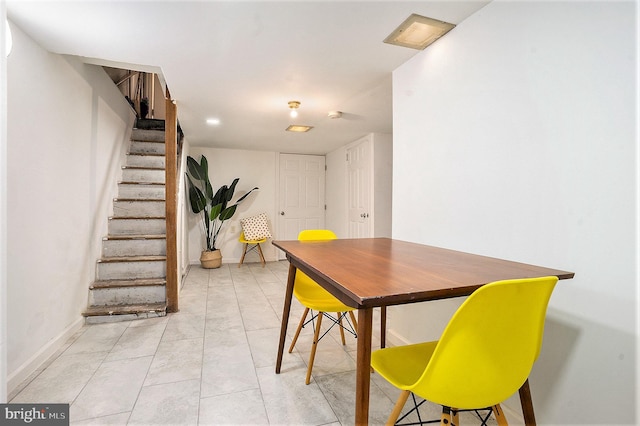 dining area with light tile patterned flooring