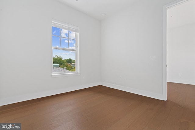 spare room featuring hardwood / wood-style flooring