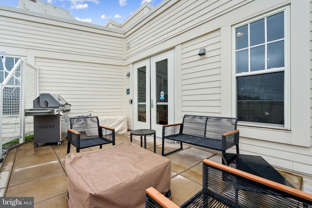 view of patio with an outdoor hangout area, a grill, and french doors