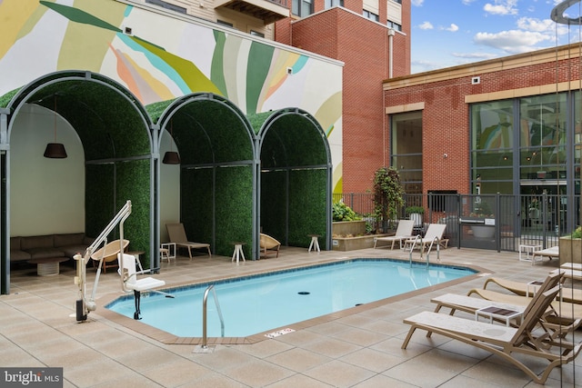 view of swimming pool featuring a patio area