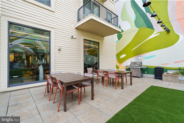 view of patio / terrace featuring a balcony and a grill